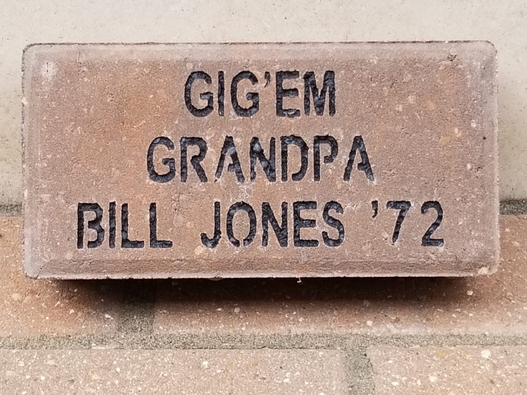 A brick with "Gig'Em, Grandpa, Bill Jones '72" Engraved.