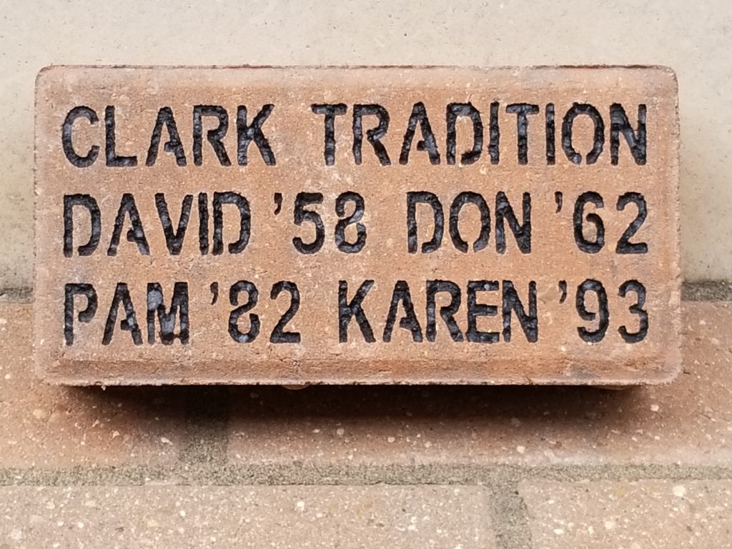 A brick with "Clark Tradition, David '58, Don '62, Pam '82, Karen '93" engraved.